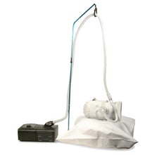 CPAP Hose Lift Travel System Shown with Mannequin and Pillow (Not Included)