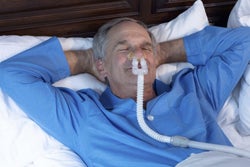 Bleep CPAP Mask on CPAP patient in Bed