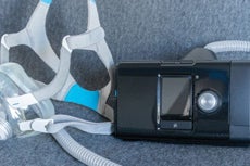 airsense 10 CPAP machine connected to an airfit f20 full face mask