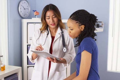 a doctor assisting a women